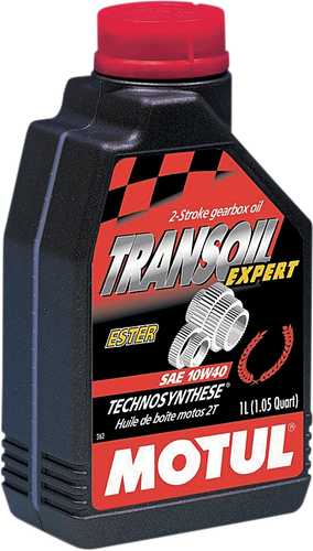 A high-resolution studio product photograph of a 1-liter bottle of Motul Transoil Expert Technosynthese Transmission Fluid in 10W-40 viscosity, set against a clean white background. Standing upright at a front-facing angle, the sleek dark gray plastic bottle features a textured ergonomic grip and a red twist-off cap. The dynamic front label displays the bold white "MOTUL" logo vertically alongside a vibrant green "TRANSOIL EXPERT", "10W-40", "TRANSMISSION FLUID", and "TECHNOSYNTHESE" callout, accompanied by a detailed mechanical graphic of motorcycle transmission gears, specially formulated for gearboxes with integrated wet clutches subjected to severe operating conditions in performance two-stroke and four-stroke motorcycles.