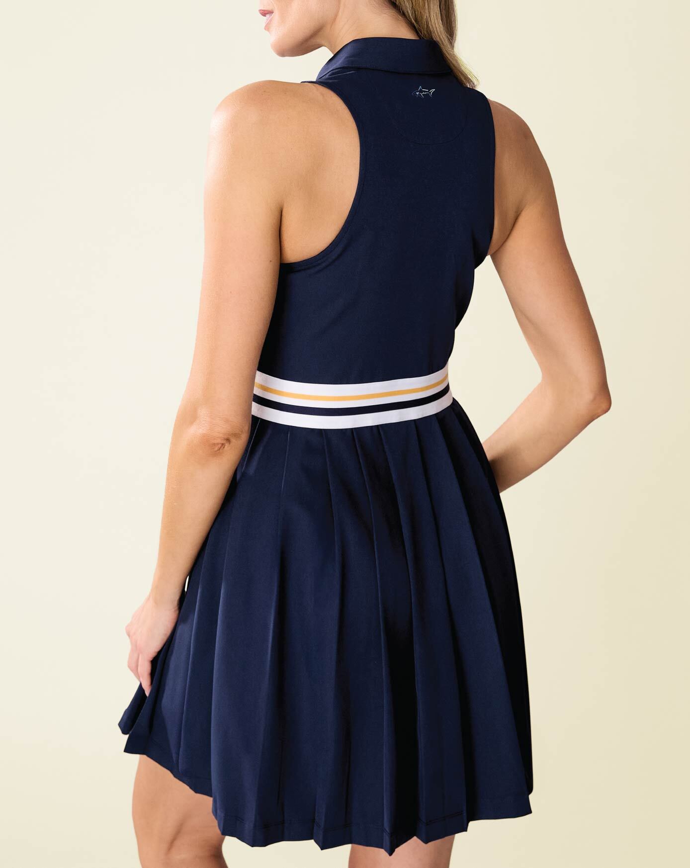 Woman wearing blue patterned dress.