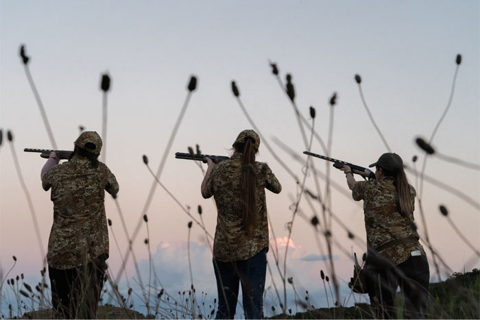 Group of women taking aim with Beretta shotguns