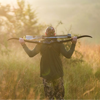 Bow Hunter Walking into the Wild with Sitka Gear