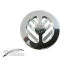 Front view of a polished round 1971–76 B-Body door jamb plug, with chevron-shaped slots and an SD logo