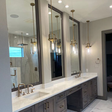 hanging pendant lights above bathroom countertop