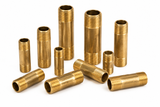 Assorted Charman red brass pipe nipples in multiple sizes and lengths with male NPT threads on both ends.