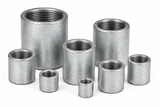Assorted Charman galvanized merchant steel couplings in multiple sizes with female threaded connections.