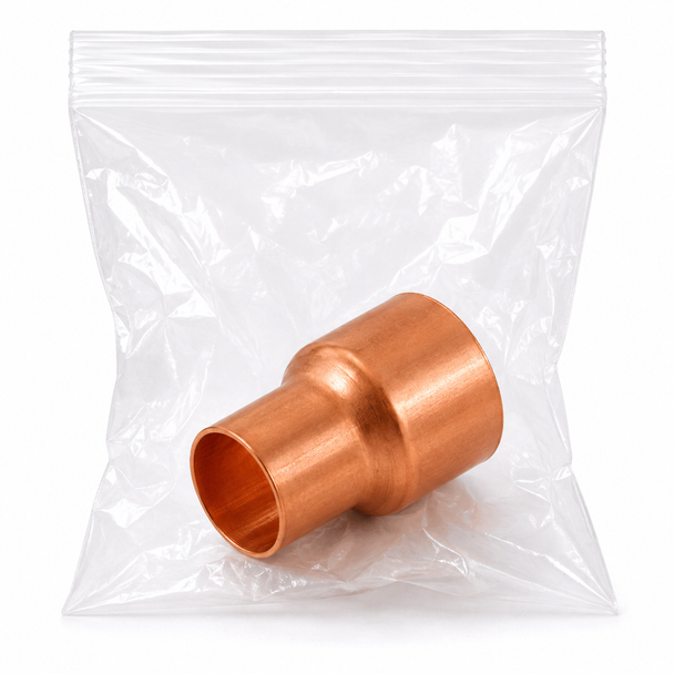 Domestic cleaned and bagged wrot copper reducing coupling for connecting two different copper tube sizes in clean and controlled piping systems.