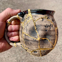 DAY 1, March 18th, 2024: Smashed Mug, Glued Back Together and Gilded with 24 Karat Gold, Non-Functional Sculpture