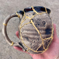 DAY 2, March 19th, 2024: Smashed Mug, Glued Back Together and Gilded with 24 Karat Gold, Non-Functional Sculpture