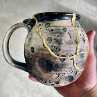 DAY 6, March 23rd, 2024: Smashed Mug, Glued Back Together and Gilded with 24 Karat Gold, Non-Functional Sculpture