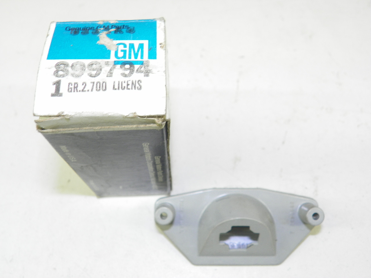 GM 899794 NOS Rear License Plate Light for 1974 Corvettes restoration. - Image 1
