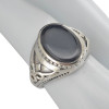 Black Onyx Sterling Silver Ring. An oval-shaped black onyx gemstone is set in genuine .925 sterling silver.