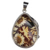 Amber Cameo Fairy & Sunflower Pendant. A dark cognac amber stone featuring a carved image of a fairy and sunflower is set in genuine .925 sterling silver. Handcrafted from authentic Baltic amber.