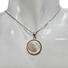 Mother of Pearl Sterling Silver Pendant.
A round mother-of-pearl shell is set in .925 sterling silver.