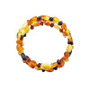 Multi-color amber memory wire bracelet. Round, olive and free-shaped amber beads are set on a wire. Genuine Baltic amber.