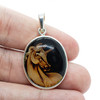 Carved Amber "Unicorn" Reversed Intaglio Pendant
