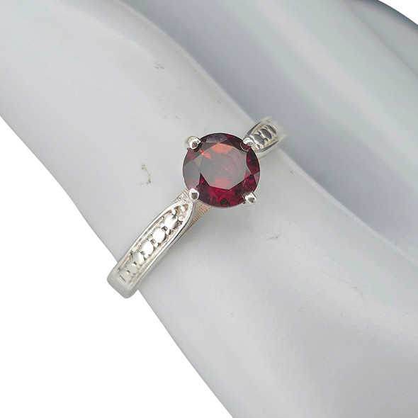 Faceted garnet sterling silver ring.