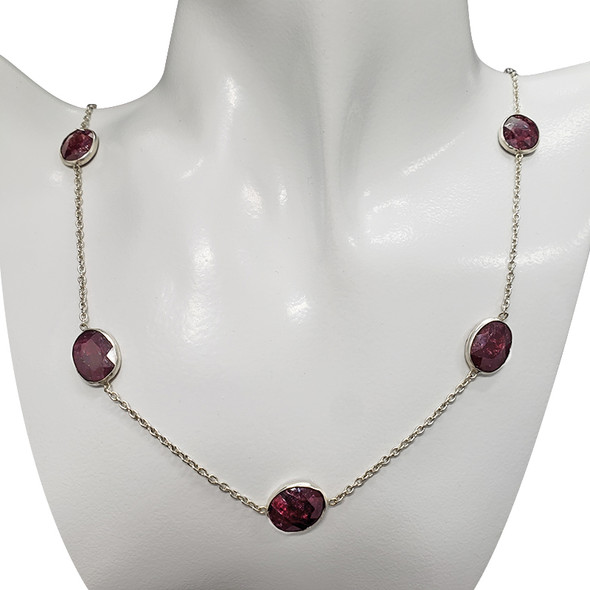 Composite Ruby Stones Sterling Silver Necklace. Oval-shaped stones are set in .925 sterling silver. 24'' long.