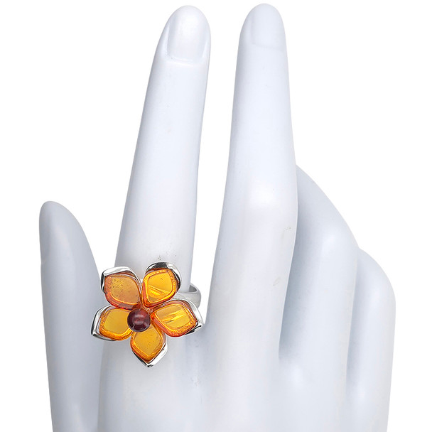 Amber Sterling Silver Flower Adjustable Ring. Marquis and round-shaped genuine Baltic amber stones in cherry and cognac colors are set in .925 sterling silver. Elegant adjustable flower design.