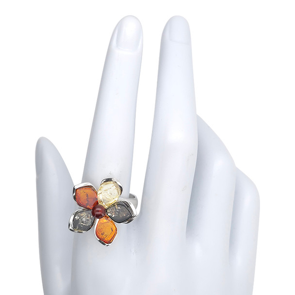 Multi-Color Amber Sterling Silver Flower Adjustable Ring. Green, citrine, cognac, and cherry-colored genuine Baltic amber stones are set in .925 sterling silver. Elegant adjustable flower design.