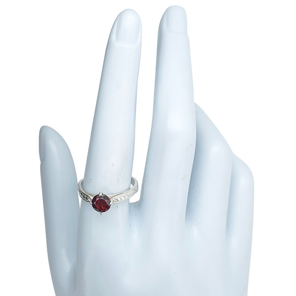 Faceted garnet sterling silver ring.
