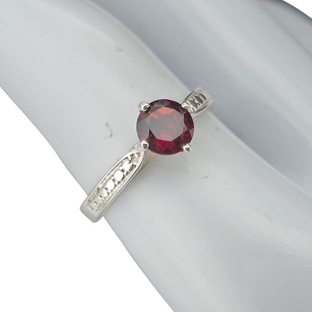 Faceted garnet sterling silver ring.