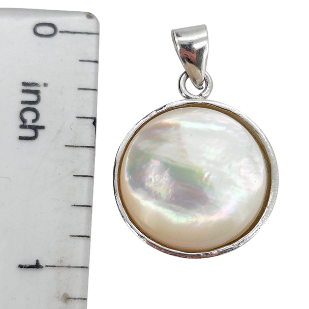 Mother of Pearl Sterling Silver Pendant.
A round mother-of-pearl shell is set in .925 sterling silver.