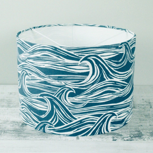 a large 30cm handmade fabric lampshade in a blue surf print cotton fabric.