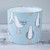 A 20cm wide handmade fabric lampshade. The fabric print is an illustrated seagull design on a duckegg blue background
