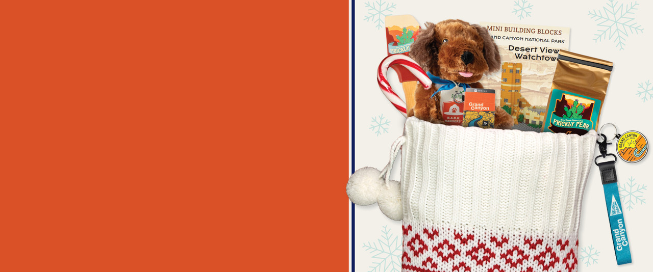 Candy cane, plush dog, prickly pear coffee, and other gifts in a Christmas stocking.