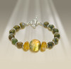 The Freedom From Worry Bracelet - Energetically lifts you above your fears and finds new ways to solve your biggest problems.   - Labradorite sun disk, citrine, rain forest rhyolite.