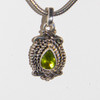 Item A15 Live Show.  Journey Of The Soul Peridot Pendant.  4 double scrolls representing the soul's journey.  Chain not included.
