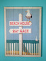 Rat Race, Beach House Wall Sign