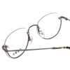 Close Up View of DKNY DK1000 Designer Reading Eye Glasses with Custom Cut Powered Lenses in Satin Grey Tortoise Ladies Round Semi-Rimless Metal 52 mm