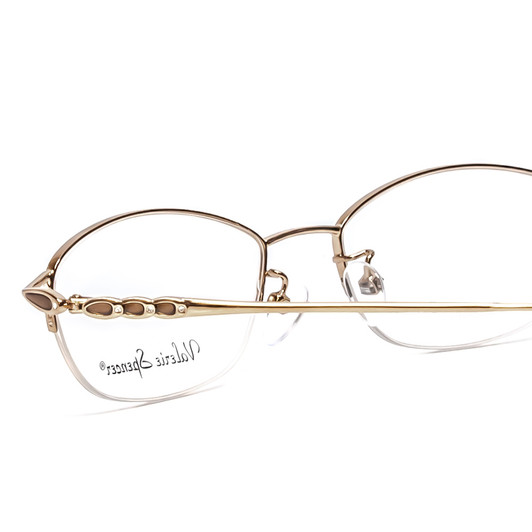 Close Up View of Valerie Spencer VS435-GBR Designer Single Vision Prescription Rx Eyeglasses in Gold Brown Ladies Oval Semi-Rimless Metal 51 mm