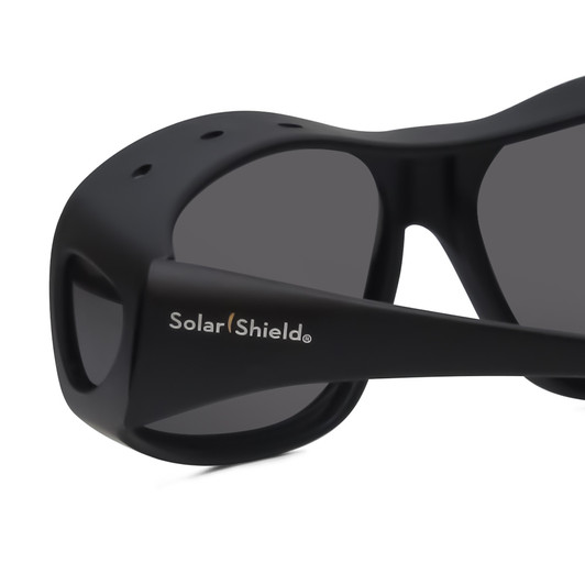 Close Up View of Foster Grant Solar Shield 68mm Fitover Sunglasses Matte Black & Smoke Grey Flash