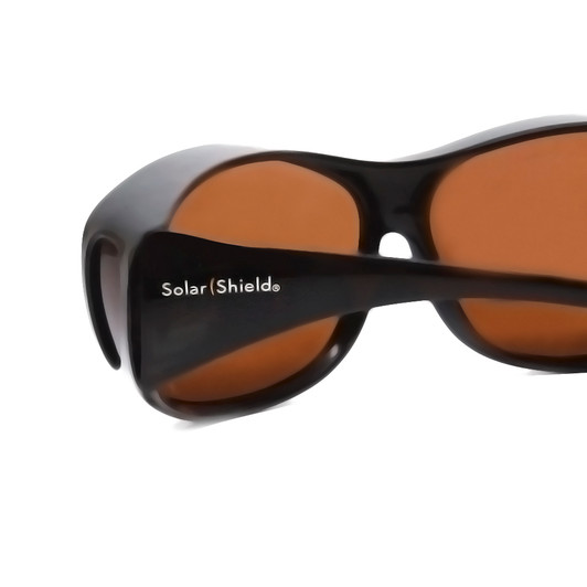Close Up View of Foster Grant Shield Oval 70 mm Fitover Sunglasses in Tortoise Havana/Amber Brown
