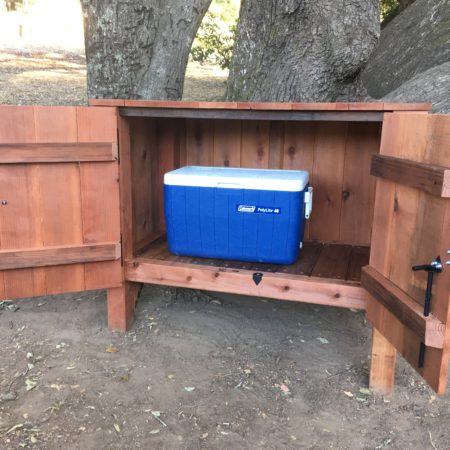 Cooler sitting in storage box