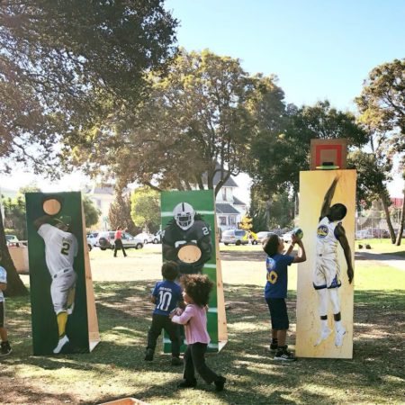 Kids playing with face cutouts