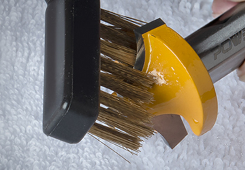 a wire brush that can be used to clean a router bit