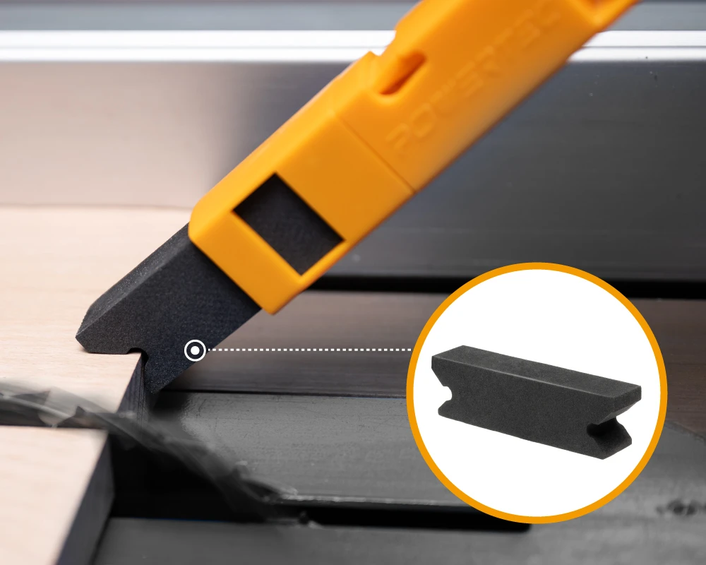 Close-up of high-density EVA push stick tip contacting a wood workpiece