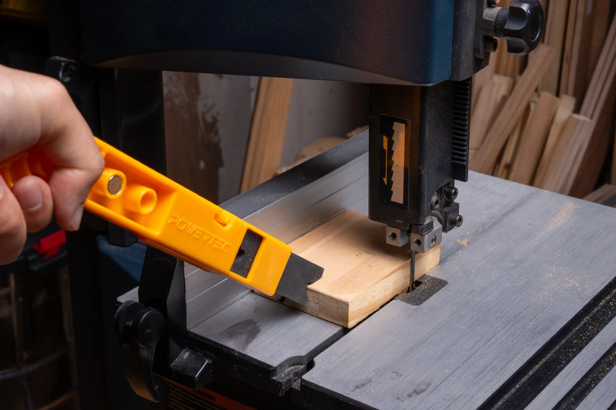 EVA push stick controlling a narrow rip cut on a table saw