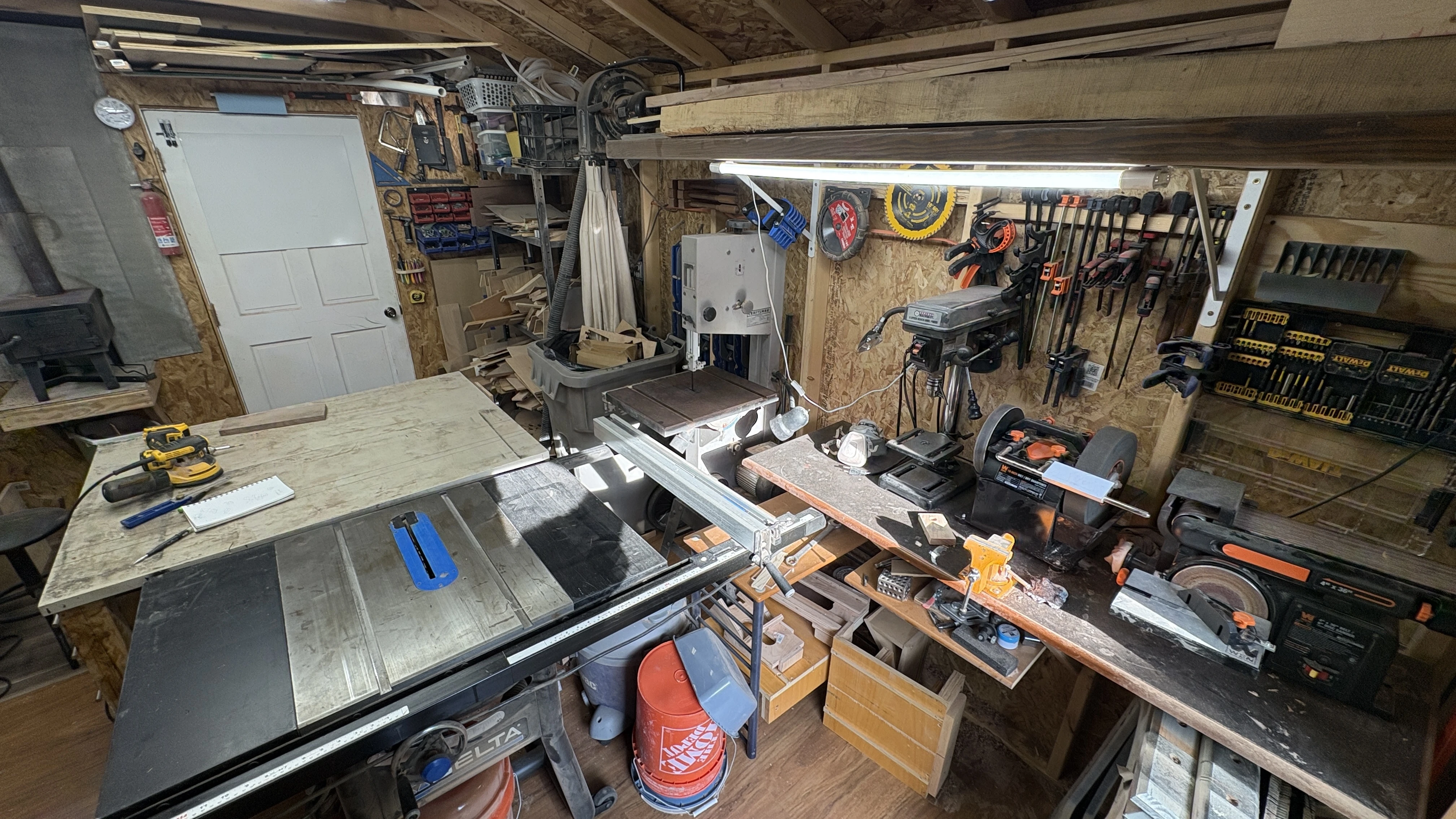 Sawdust built up throughout the small woodworking shop before the dust collection upgrade