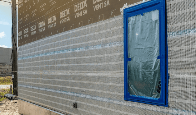 Common Moisture Failures Behind Stucco, Stone & Fiber Cement Walls — and How DELTA®-DRY Helps Prevent Them