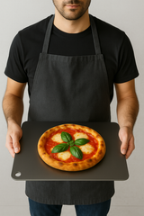 Home baker using Cooking Steels 14x20 sourdough package — wooden peel and baking steel in action for effortless dough transfer and perfect oven spring.