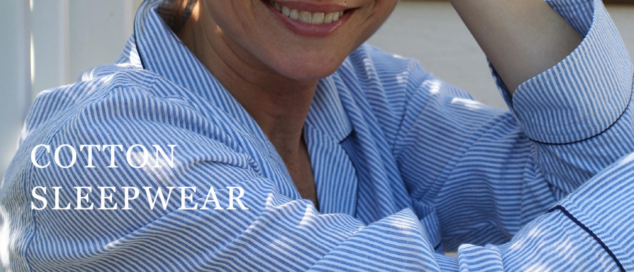 Closeup of woman wearing blue seersucker pajamas 