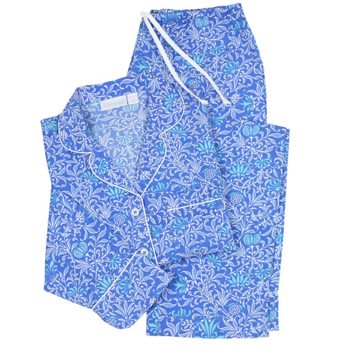 Women's printed cotton pajama set in a dark blue and turquoise pattern. Long sleeve, two-piece set folded flat.