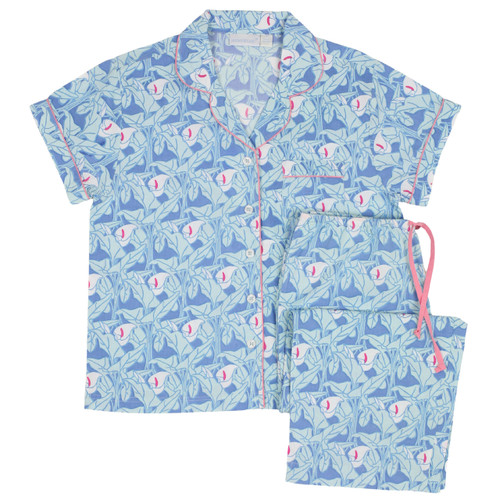 Women's cotton poplin button-down short sleeve pajama with capri pants.  Blue, aqua and pink colored pattern. Two-piece pajama set folded flat.