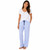 Women's all cotton blue and white classic seersucker sleep pants worn by woman with left hand in pocket.