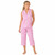 Woman standing wearing printed sleeveless pajamas with capri pants in a pink and periwinkle paisley pattern wearing.