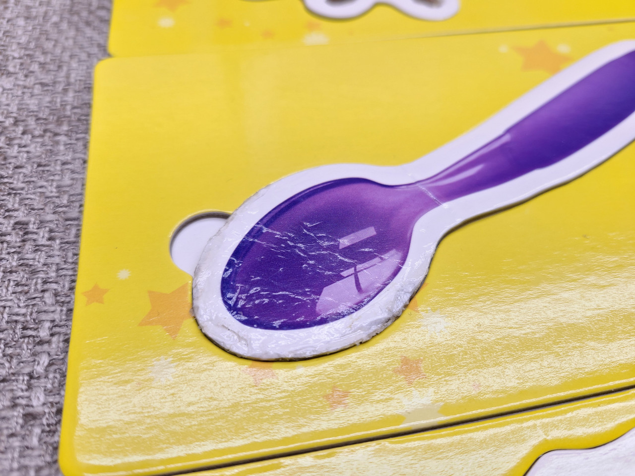 This is the "spoon" First Words Card that has teeth marks on it