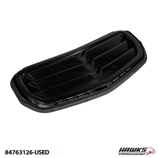 Angled top view of the black 2019–2024 Camaro SS hood scoop vent showing the louvers and outer trim edge.